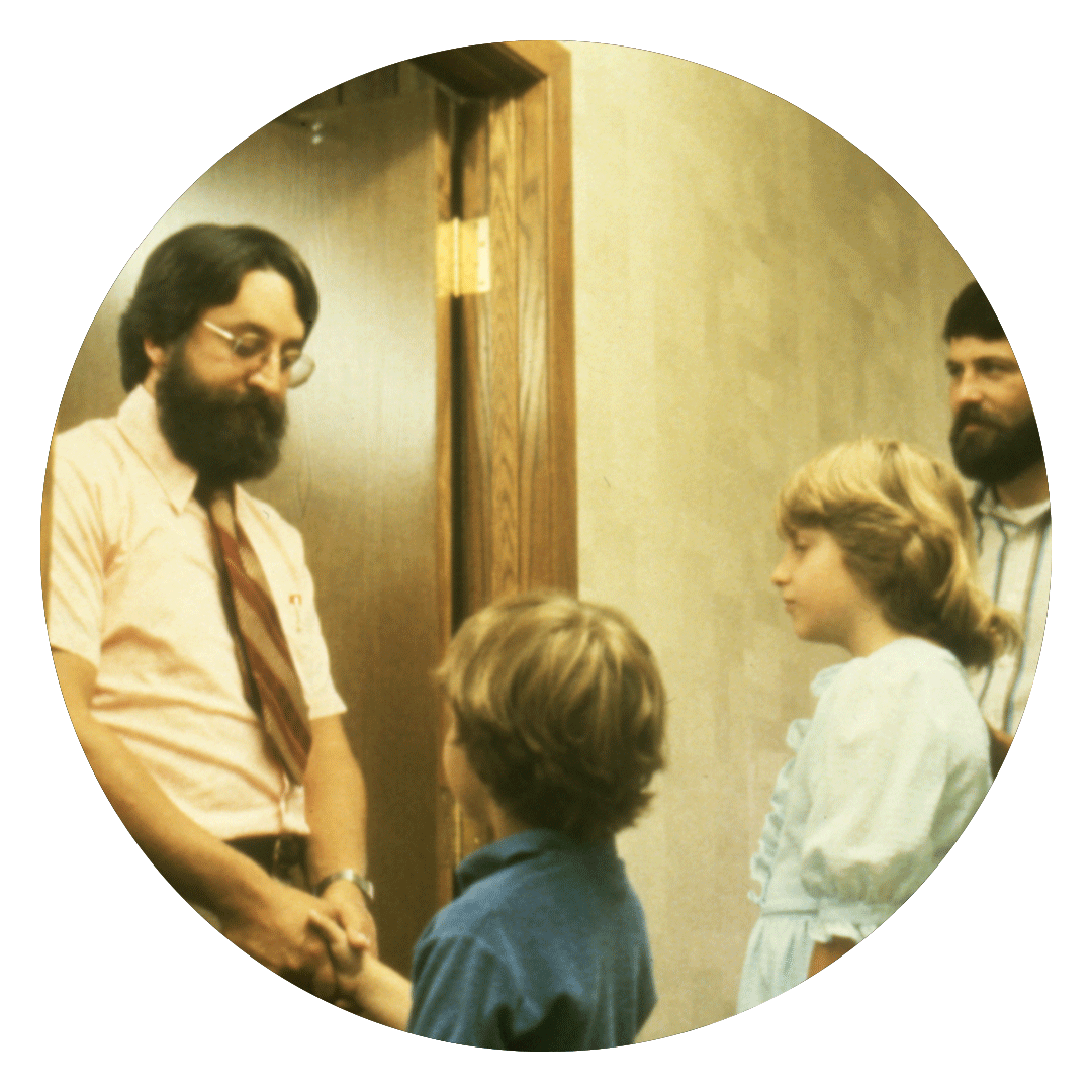 Young family meeting with a Family Service Rochester representative.