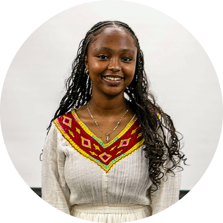 Ethiopian teenage girl wearing red and white dress