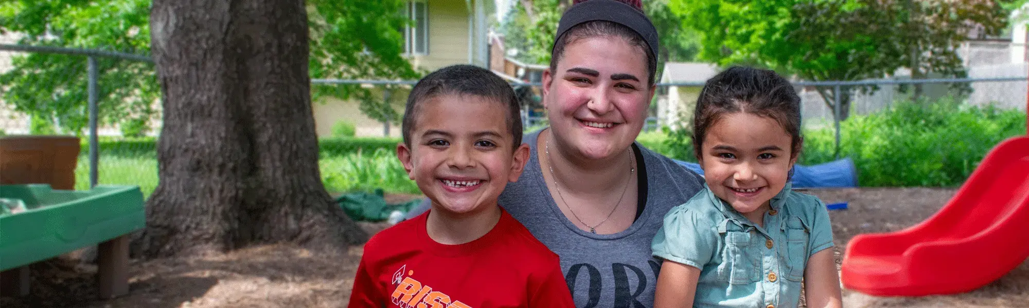 Young family of three smiling