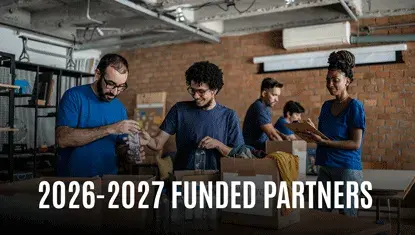 Volunteers organizing supplies, text reads 2026-2027 Funded Partners